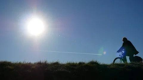 Sun backlight bike couple Video stock 108444701