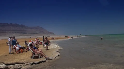 Sun-baths at shore of the Dead sea Stock Footage 39672883