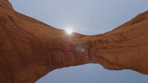 Sun Beam Through An Rock Arch Of Red Orange Colored In Arches National Park Stock Footage 121627613