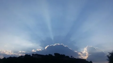 Sun Beaming Clouds Stock Photos