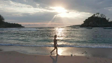 Sun Beaming from Sky and Reflecting on the Beautiful Ocean Waters in Indonesia Stock-Footage 133823649