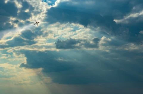 Sun beams or light rays breaking through the clouds. Stock Photos