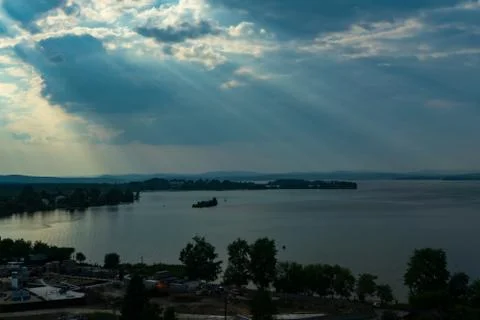 Sun beams or light rays breaking through the clouds. Stock Photos