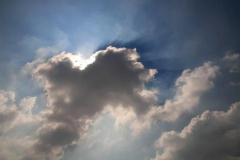 Sun beams passing through clouds Stock Photos