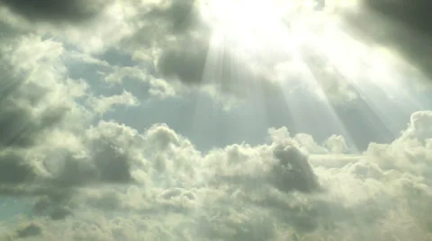 Sun beams shining trough moving clouds timelapse Stock Footage 32723843