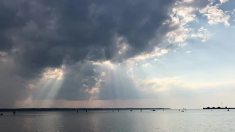 Sun beams through clouds Stock Footage 202082581