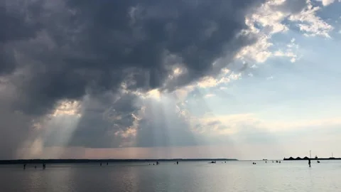 Sun beams through clouds Stock Footage 202082598
