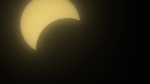 Sun Becoming Eclipsed by Moon with Light Cloud Haze Stock Footage 272698876