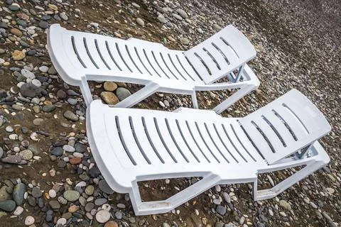 Sun beds on the beach Stock Photos