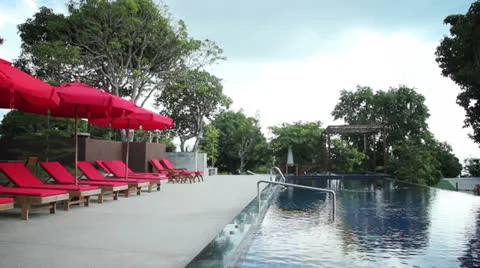 Sun beds by the swimming pool Stock Footage 22537108