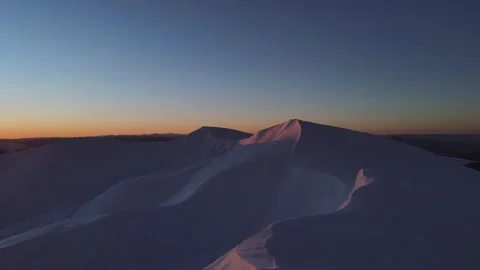 The sun begins to rise in the winter mountains Video stock 264985845