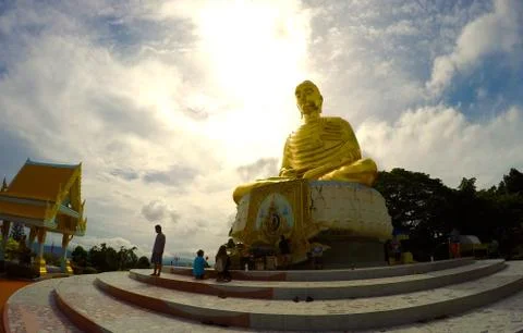 Sun behind buddha statue Stock Photos