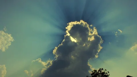 Sun Behind the clouds and sun rays shining behind clouds Stock Footage 91640355