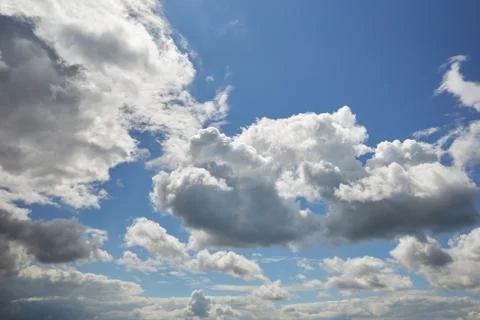 The sun behind the clouds lit up the blue sky Stock Photos
