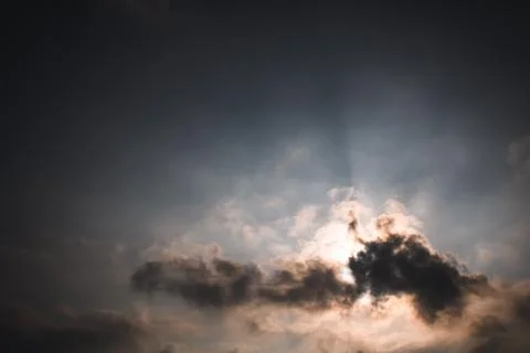 Sun Behind Clouds. Stock Photos