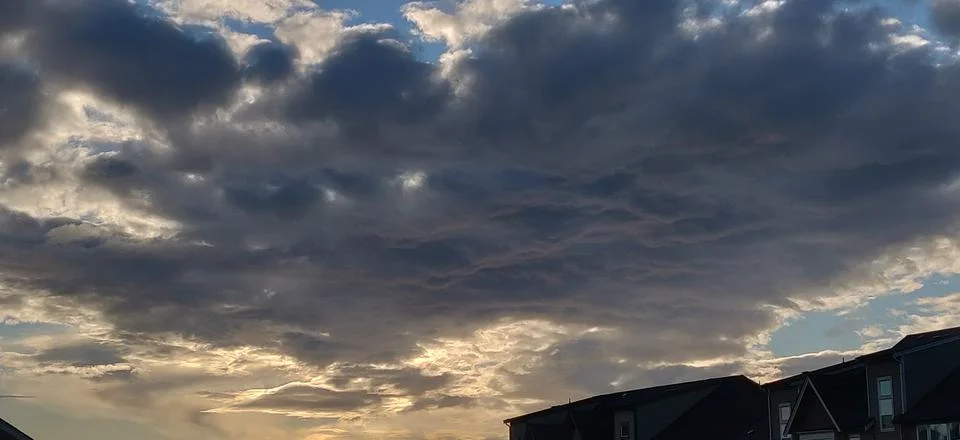 The sun behind clouds Foto stock