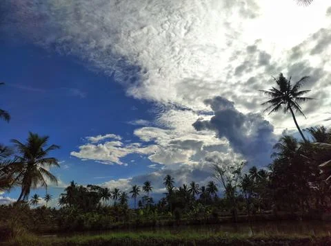 The sun behind the clouds Stock Photos