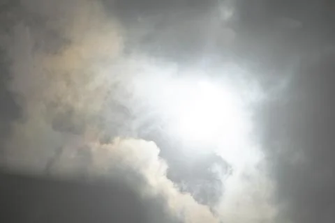 The sun behind the clouds Stock Photos