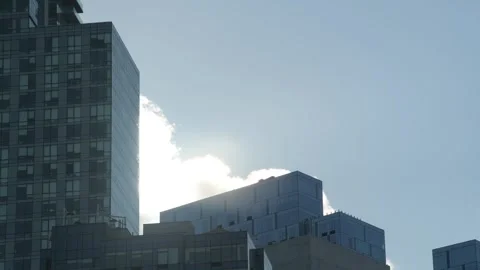 Sun Behind Clouds Vanishes over NY Skyscrapers Stock Footage 326373745