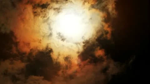 Sun behind dark cloud Vídeos de archivo 10878505