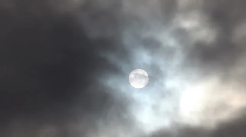 Sun behind the dark clouds in the sky Stock Footage 22536478