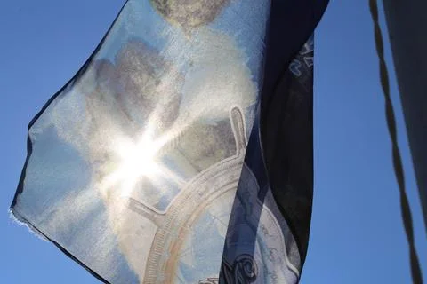 Sun behind the flag Stock Photos