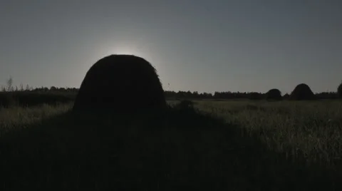 Sun behind haystack Video stock 53795414