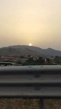 Sun behind the hill Stock Photos