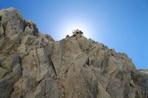 The sun behind the mountain Stock Photos