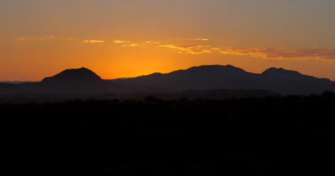 Sun behind the mountains in the Desert Stock Footage 138726489