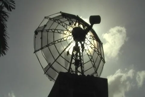 Sun behind old satellite dish antenna Stock Footage 702753