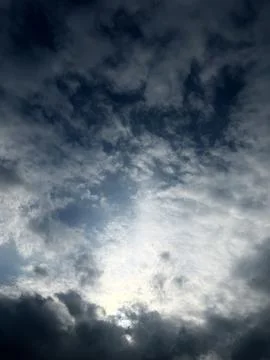 Sun Behind Textured Clouds Creating Dramatic Light Stock Photos
