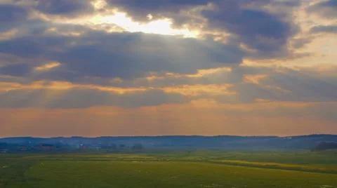 The sun behind the thunderstorm clouds. Time lapse Stock Footage 47844295