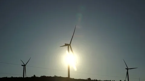 Sun behind windmill 03 Stock Footage 114687787