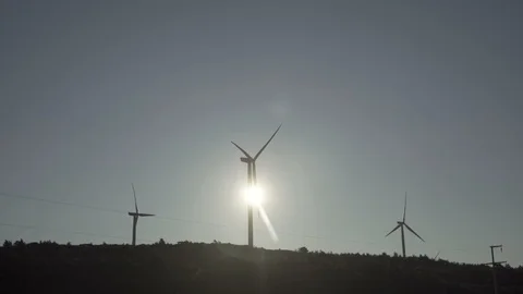 Sun behind windmill Stock Footage 114687884