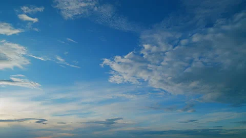 Sun below horizon and clouds in fiery dramatic sky. Cirrus clouds illuminated by Stock Footage 210648631