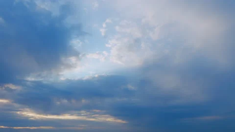 Sun below the horizon and clouds in the fiery dramatic sky. Clouds illuminated Stock Footage 212197777