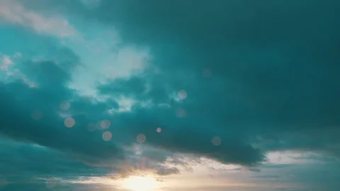 Sun below the horizon and clouds in the fiery dramatic sky. Clouds illuminated Stock Footage 265092736