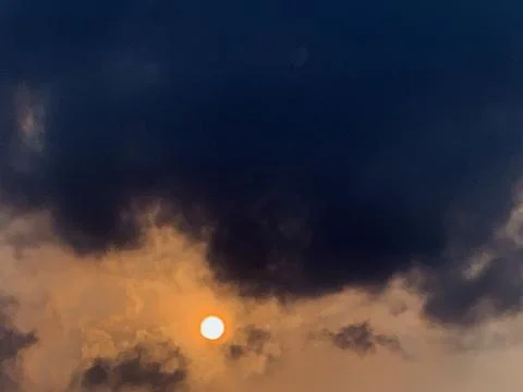 Sun Beneath Dark Storm Clouds Above Jakarta Indonesia Stock Photos