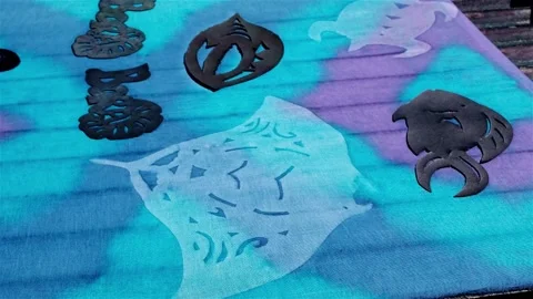 Sun bleached patterns on a cotton tie dye fabric Stock Footage 249324327
