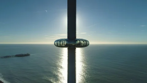 Sun blocked out by i360 viewing tower pod with people inside, drone aerial 4K Stock Footage 101204012