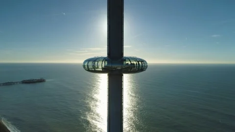 Sun blocked out by i360 viewing tower pan round view, drone aerial 4K Stock Footage 101204104