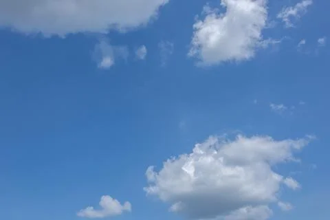 Sun, blue sky and clouds. Stock Photos