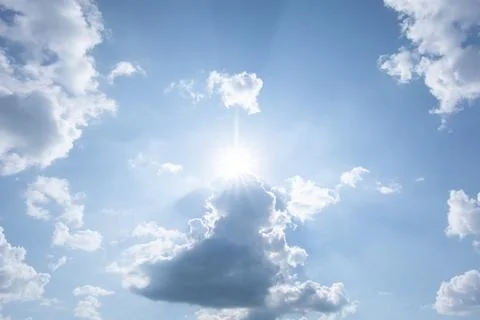 Sun, blue sky and clouds. Stock Photos