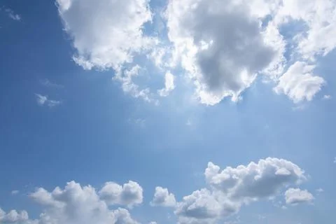 Sun, blue sky and clouds. Stock Photos