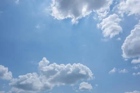 Sun, blue sky and clouds. Stock Photos