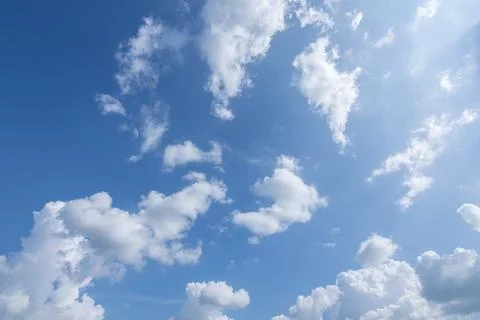 Sun, blue sky and clouds. Stock Photos
