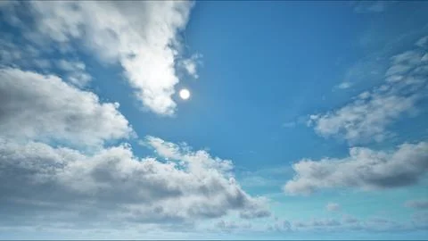 Sun on the blue sky with moving clouds Stockfoto's