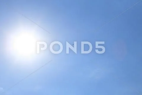 Sun on blue sky Stock Photos