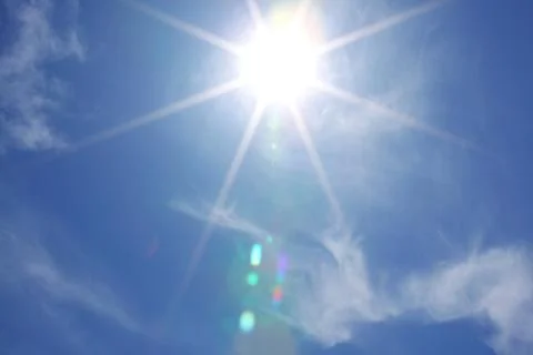 Sun in blue sky Stock Photos